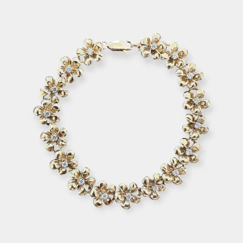 Armbånd med blomster i 14 karat guld og zirkoner