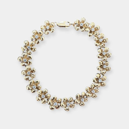 Armbånd med blomster i 14 karat guld og zirkoner
