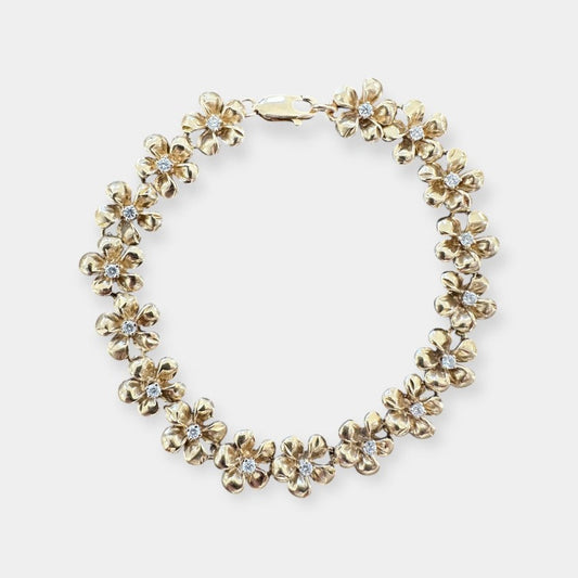 Armbånd med blomster i 14 karat guld og zirkoner