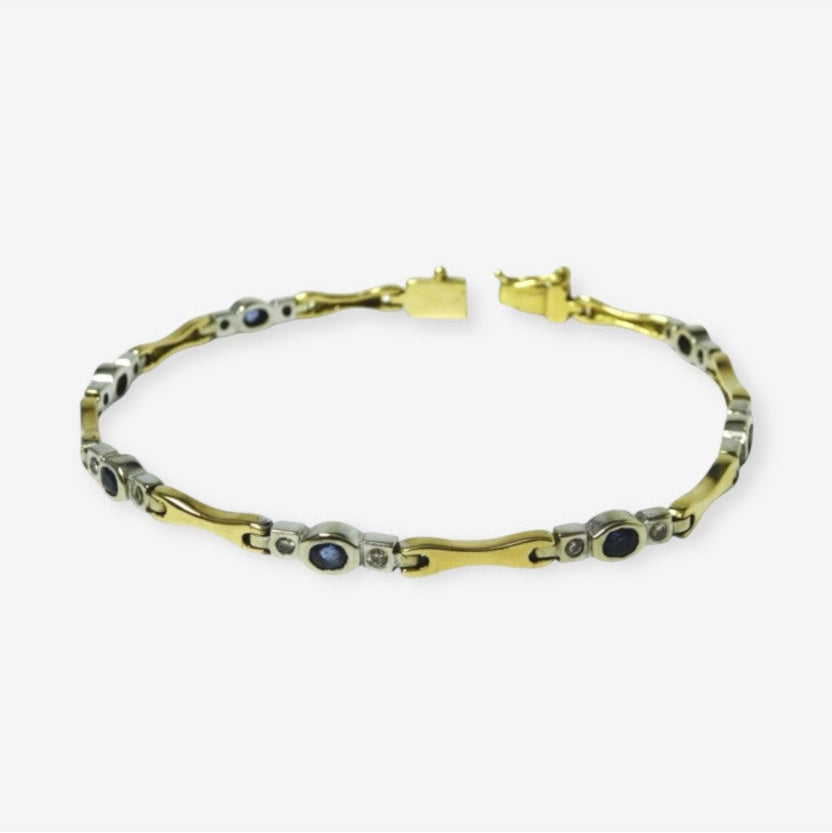 Armbånd i 18 karat guld og hvidguld med safirer og brillanter
