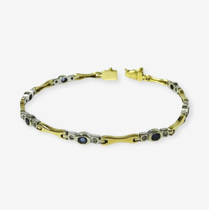 Armbånd i 18 karat guld og hvidguld med safirer og brillanter