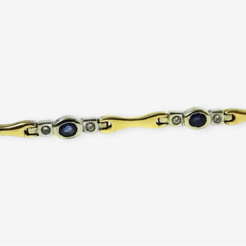 Armbånd i 18 karat guld og hvidguld med safirer og brillanter