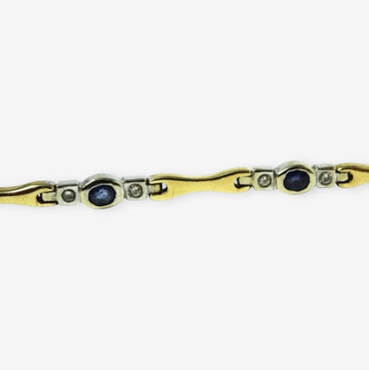 Armbånd i 18 karat guld og hvidguld med safirer og brillanter